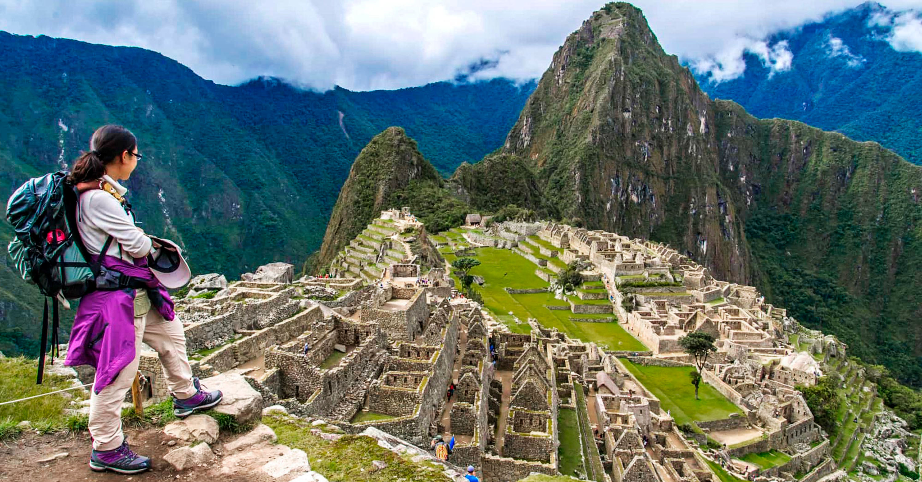 Landscape of the Machu Picchu archaeological sanctuary and surrounding lush green peaks with Peru Grand Travel