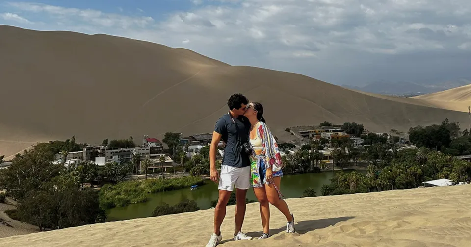 Couple overlooking Huacachina Oasis in Peru