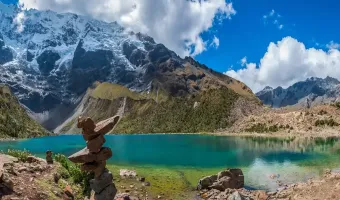 Humantay Lake with turquoise waters surrounded by snow-capped mountains in Cusco.