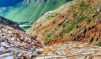 Maras Salineras displaying an expansive network of white salt-drying terraces.